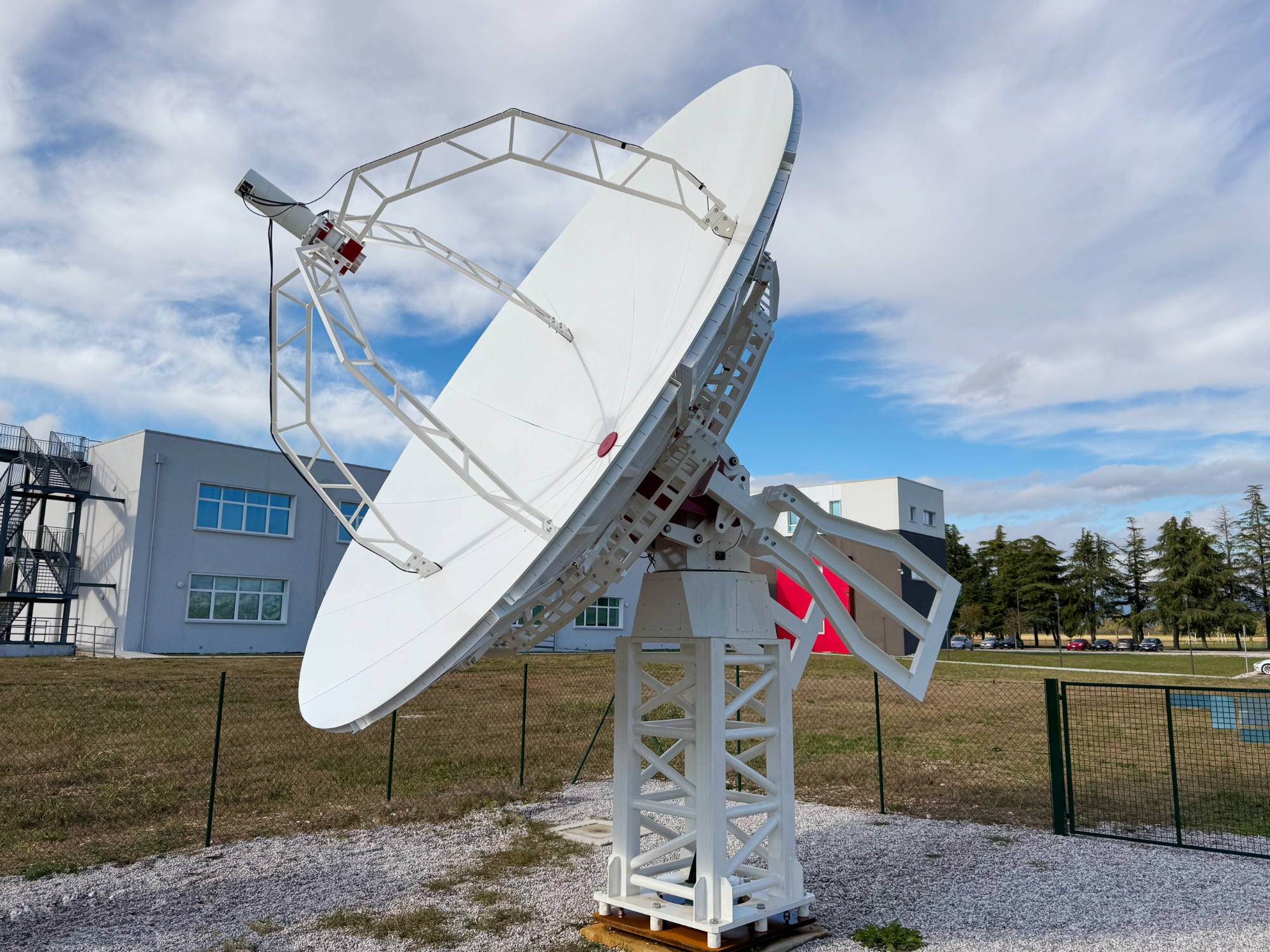 What radio frequencies are used for space communication? INTREPID 500-12 ground station with 5 meter diameter full dish antenna and X/S bands feed.